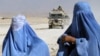 Afghanistan -- Afghan women wait for news of relatives kept at the high-security Pul-e Charkhi Prison, 28 Feb. 2006